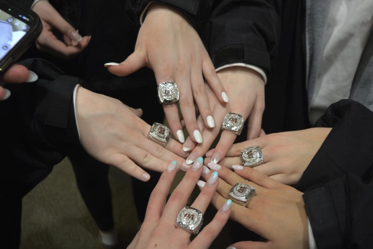 Teammates wearing their rings 